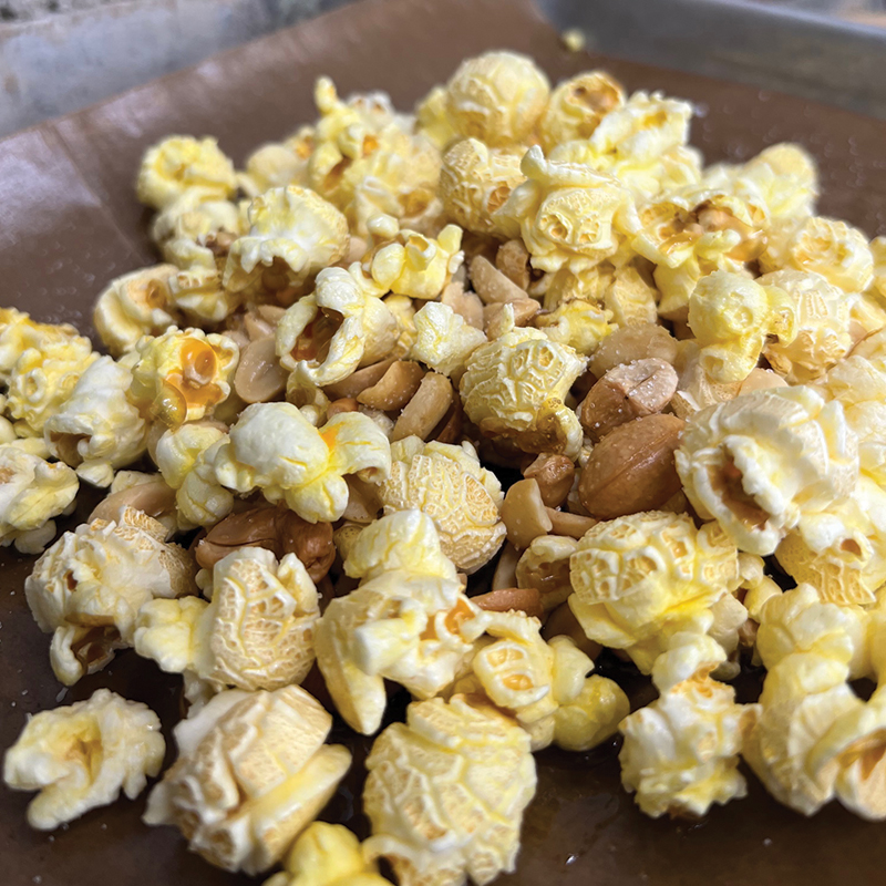 https://fourfathersbrewing.ca/wp-content/uploads/2022/01/bacon-popcorn-and-nuts-1.jpg